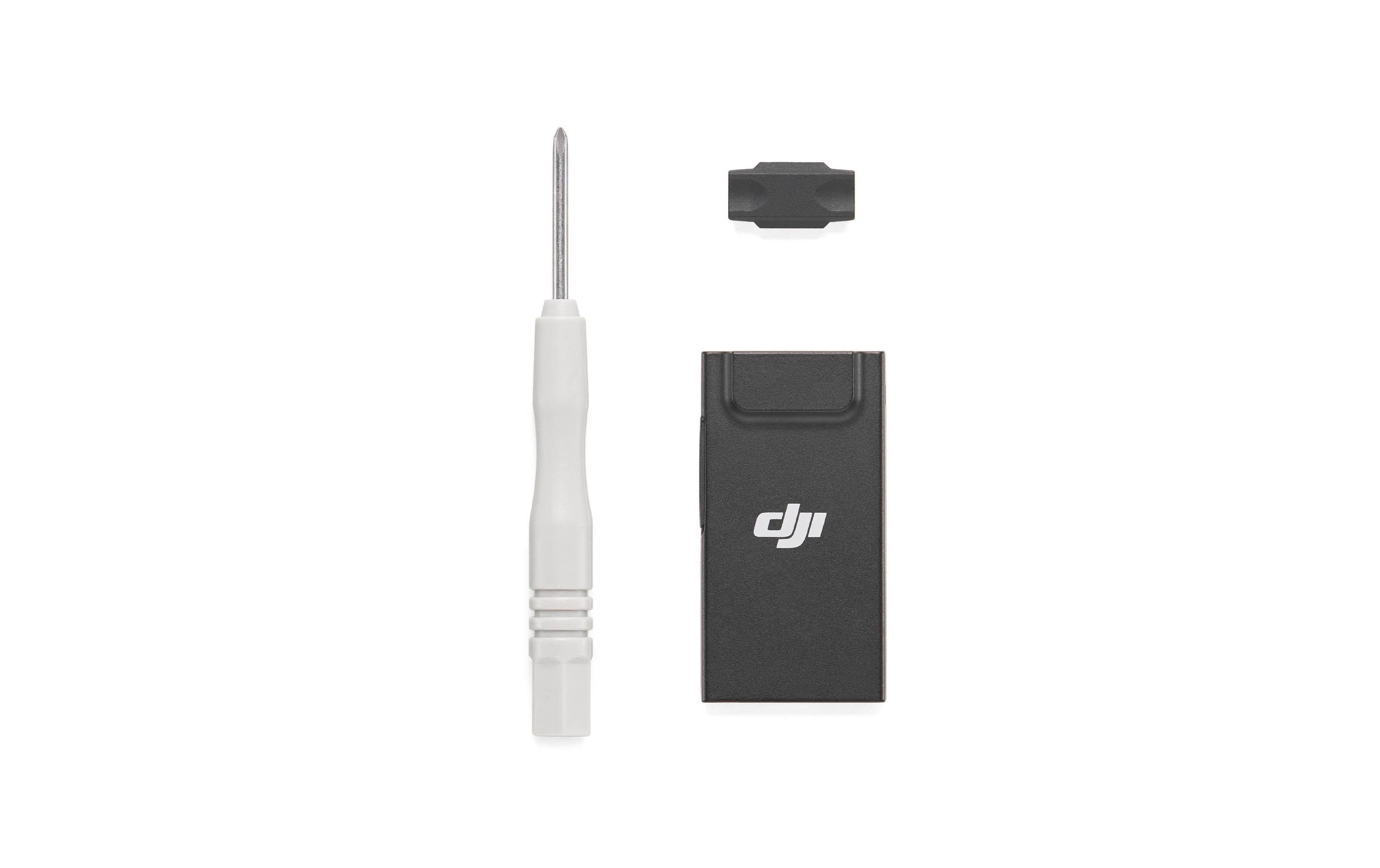 Das DJI Enterprise DJI Cellular Dongle 2 Reparaturset enthält einen kleinen Schraubendreher, ein schwarzes Gehäuse mit DJI-Logo und eine kompakte schwarze Komponente. Die Werkzeuge werden übersichtlich vor einem weißen Hintergrund präsentiert.