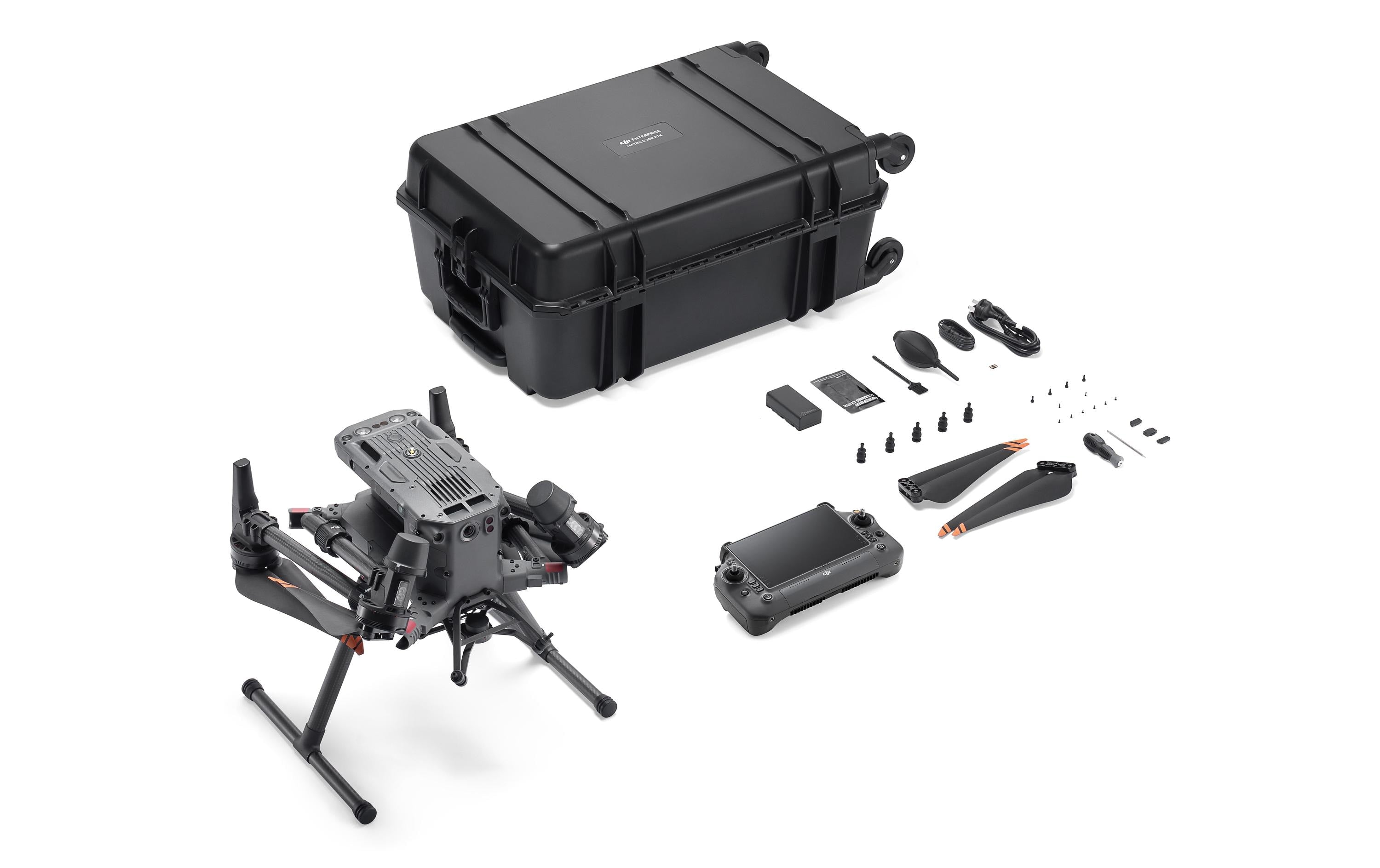 Das DJI Enterprise Multikopter Matrice 350 RTK (EU) DJI Care Basic Kit von DJI Enterprise umfasst die Drohne, die Fernbedienung, zwei Propeller, kleines Zubehör, einen Akku, ein Ladegerät und einen schwarzen Hartschalenkoffer – alles auf weißem Hintergrund abgebildet.