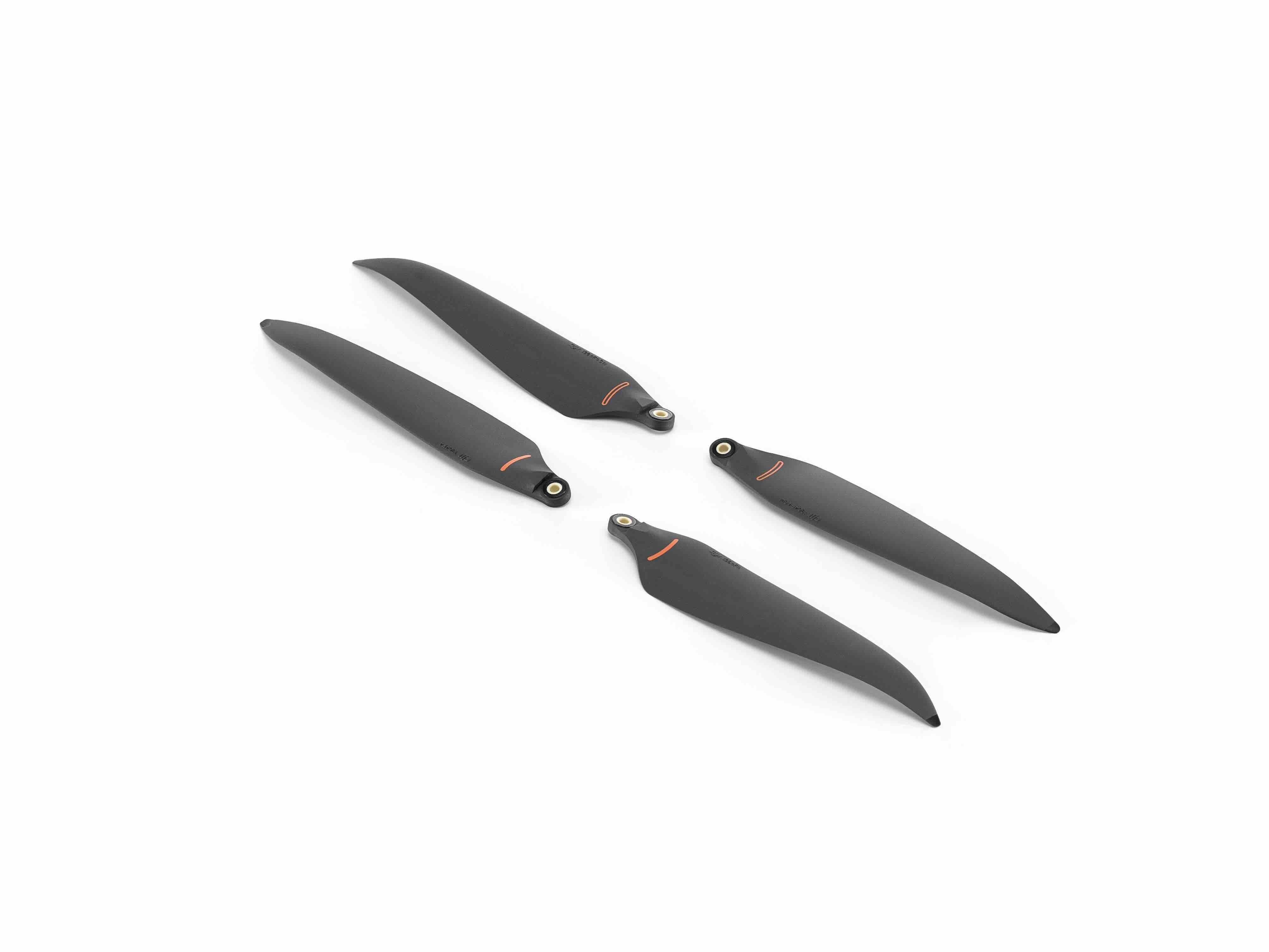 Vier DJI Enterprise Low-Noise Anti-Ice-Propeller (2 Paare) für Matrice 4D/4TD mit kleinen orangefarbenen Markierungen werden auf weißem Hintergrund angezeigt – ideal für Winterinspektionen.