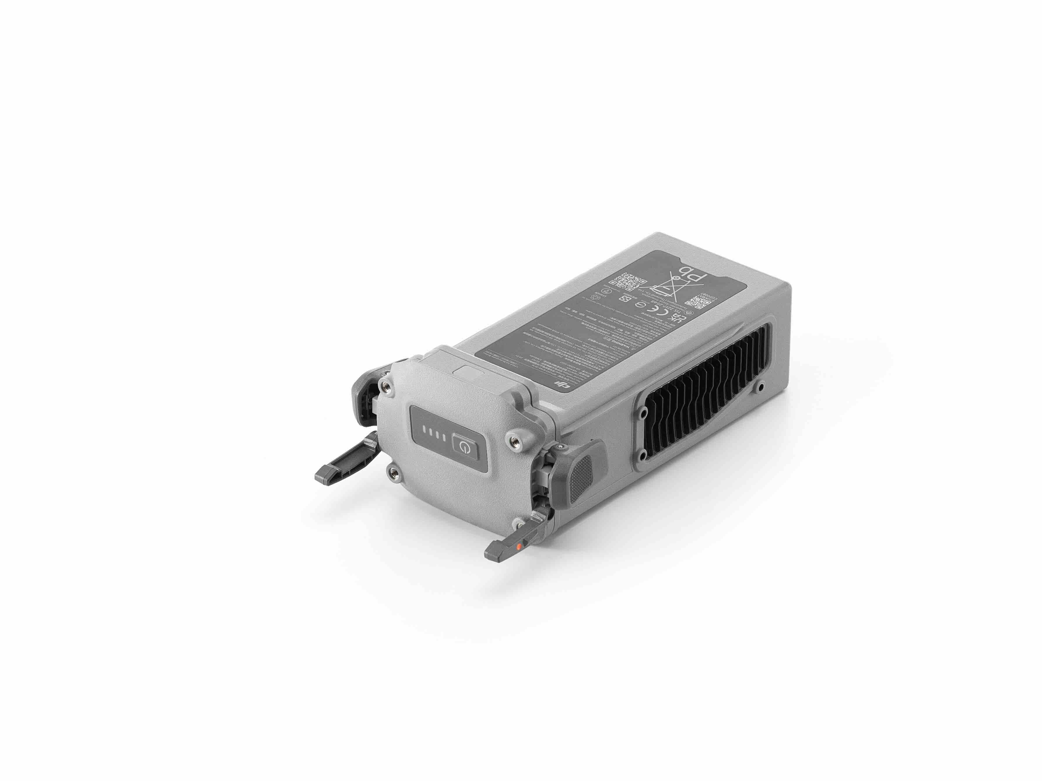 Ein grauer, rechteckiger DJI Enterprise Akku BPX230-6768-22.14 für die Matrice 4D-Serie (M4TD & M4D) mit zwei Metallzinken, schwarzen Lüftungsschlitzen an den Seiten und technischen Etiketten oben – ideal für den professionellen Einsatz – auf weißem Hintergrund.